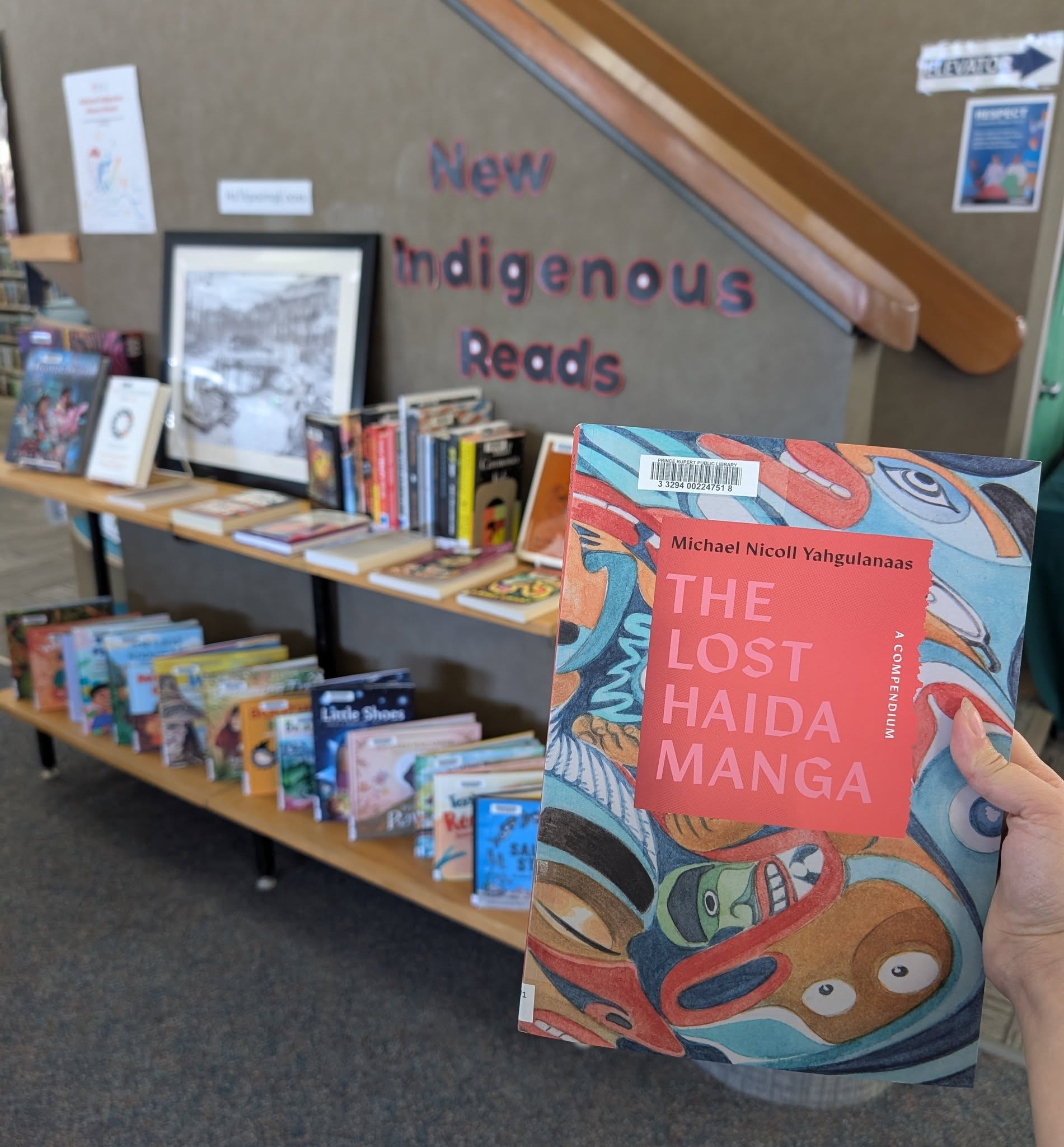 A shelf display of books by Indigenous authors, labeled "New Indigenous Reads," at the Prince Rupert Public Library.