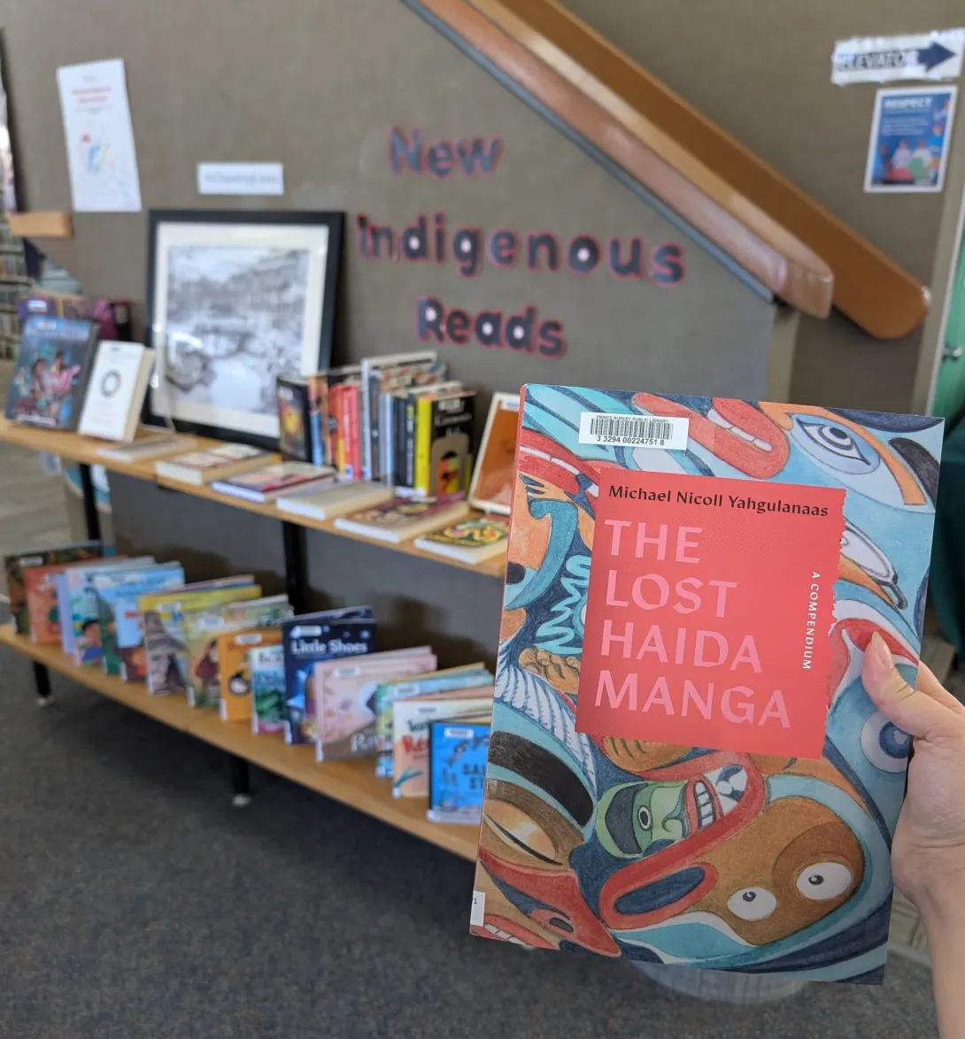 A shelf display of books by Indigenous authors, labeled "New Indigenous Reads," at the Prince Rupert Public Library.